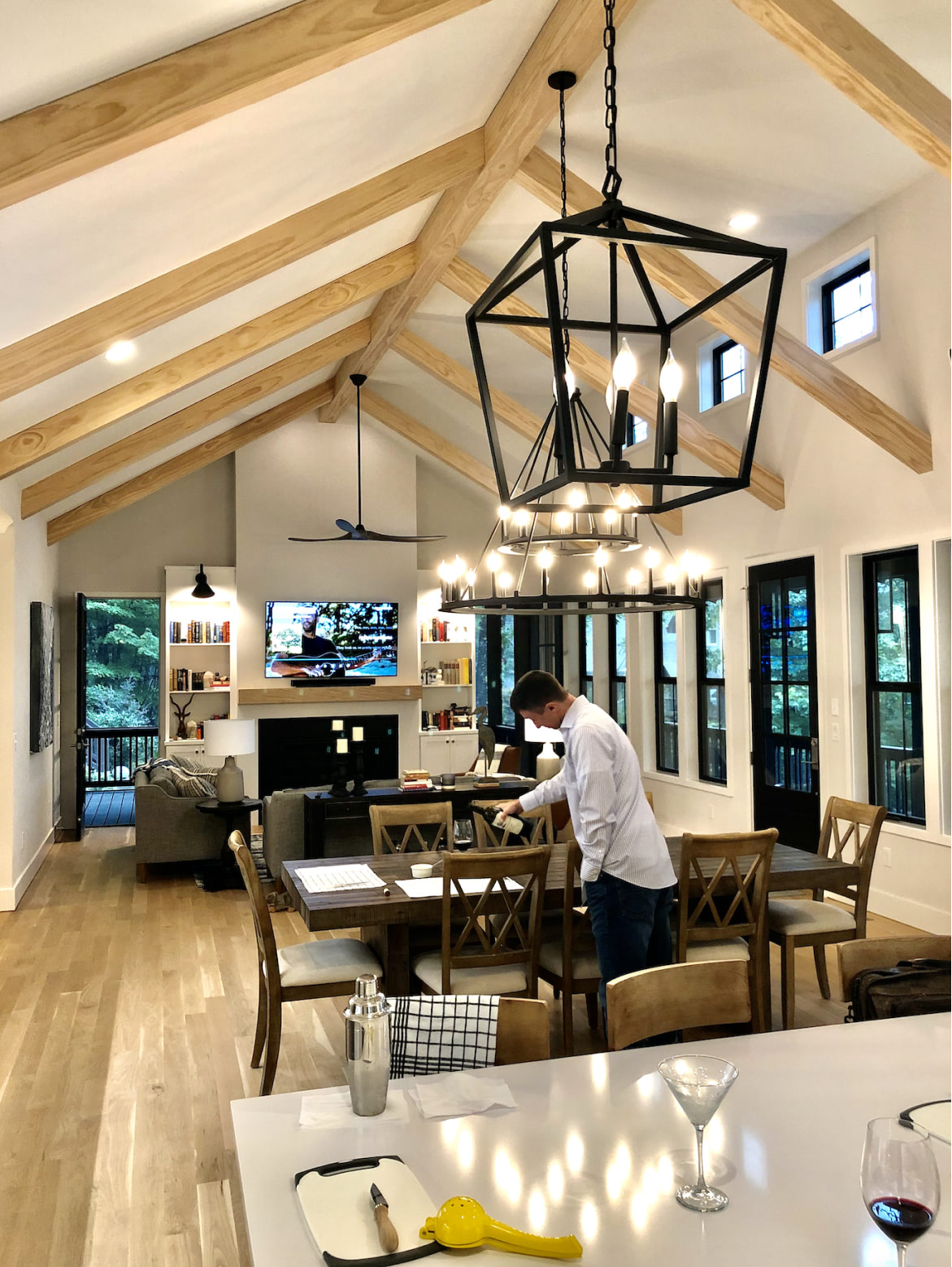 Lake Cove interior kitchen with person pouring wine